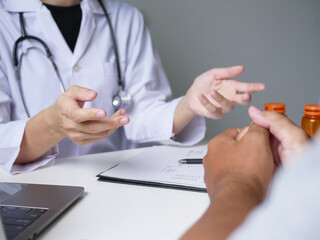 Asian female doctor explains medical information and diagnoses disease Treat patients, make...