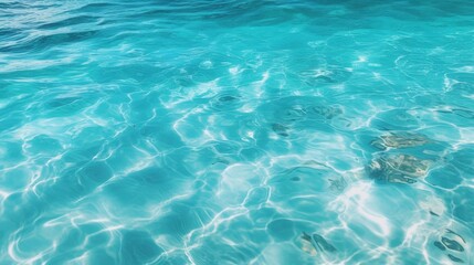 Crystal clear turquoise ocean water texture with gentle ripples