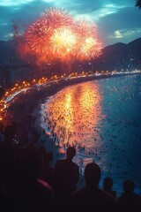 Fototapeta premium A crowd gathers on a beach to watch a vibrant fireworks display over the water.