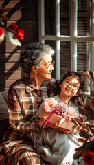 Obraz premium Grandmother and Granddaughter Sharing a Moment of Joy with a Gift
