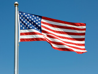 American flag waving in the clear blue sky, symbolizing patriotism, freedom, and national pride. Perfect for patriotic themes and U.S. holidays.