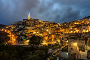 The old town of Matera at twilight with a foreboding sky
