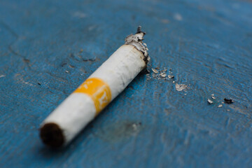 A short cigarette that is burned complete with ashes