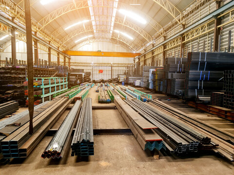 Structural Steel - Steel factory stacked steel in warehouse. ,Piles of steel boards waiting for shipping. Pipes of various materials, Business, production, manufacture and Working industry concept