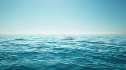 Fototapeta premium A calm ocean scene where the light blue water meets a pale horizon under a clear sky