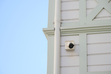CCTV security camera operating on a building 