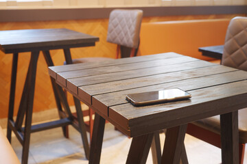 forget smartphone on a cafe table , lost smart phone 