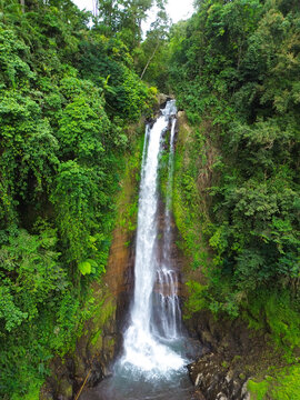 Aerial view of Gitgit waterfall in Buleleng, Bali, Indonesia with Balinese gate