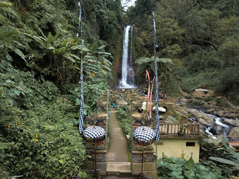 Aerial view of Gitgit waterfall in Buleleng, Bali, Indonesia with Balinese gate