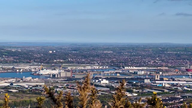 Panoramic View of Belfast Port and The Airport While a Plane is Landing from McArt's Fort, Cavehill