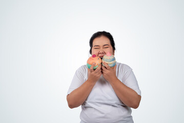 Portrait of happy young plus size woman, holding a mock up ice cream and smiling  on white isolated background,can be use as a visual to communicate  for consumption of junk food.