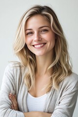 Naklejka premium Young blond woman is smiling, solid clear white background