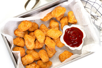 Homemade chicken nuggets with ketchup
