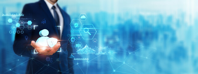 Data Protection: Businessman holding security icon. Digital technology era of future. Implementing...