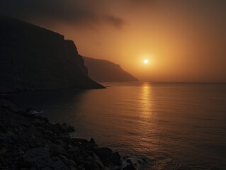 Fototapeta premium An orange-hued seascape at sunset, capturing the tranquil beauty of the moment and the gentle waves lapping at the shore.