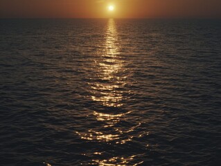 Fototapeta premium An orange-hued seascape at sunset, capturing the tranquil beauty and enchanting ambiance of the moment.