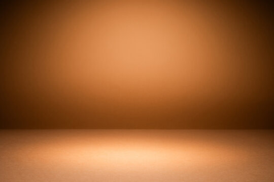 Orange brown background illuminated by soft lighting, creating a warm atmosphere suitable for display use.