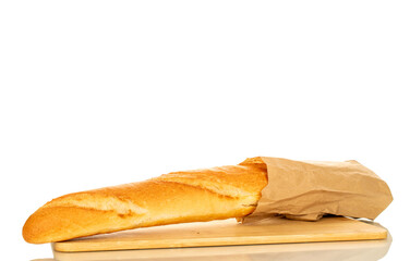 One fragrant baguette in a paper bag on a bamboo kitchen board, macro, isolated on white background.