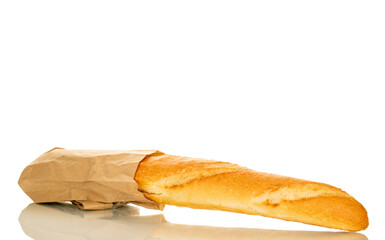 One aromatic baguette in a paper bag, macro, isolated on white background.