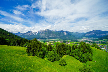 Naklejka premium View from the Reiterkogel mountain near Saalbach Hinterglemm. Landscape on the mountain with the surrounding nature. Mountain group of the Kitzbühel Alps. 