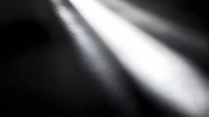 Abstract light rays creating a contrast on a dark surface.