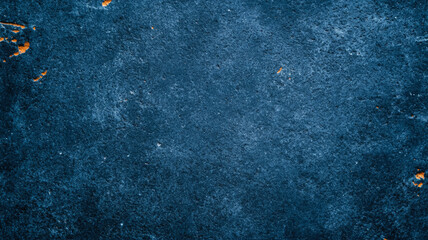 Distressed stone surface in dark blue with white and orange accents for International Astronomy Day grainy texture with scattered star like patterns and subtle celestial vibes 