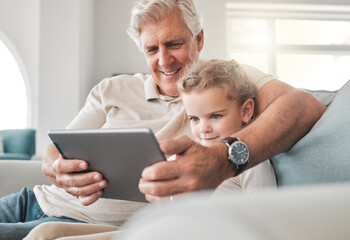 Obraz premium Tablet, relax and grandfather with child on sofa watching movie, show or film on streaming website. Happy, bonding and senior man with girl kid streaming video on digital technology in lounge at home