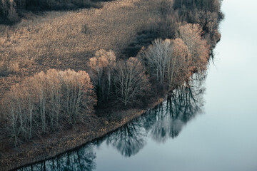 Aerial landscape picture of river bends in the countryside of Lecco province, near the Adda River