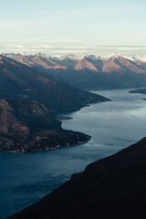 Stunning aerial view of Lake Como and Italian Alps from the summit of Monte San Primo, during a winter sunset