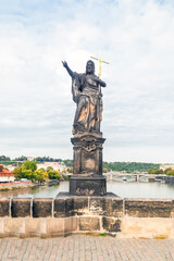 Obraz premium Statue of Saint John the Baptist by Josef Max on Charles Bridge, Prague, Czech Republic