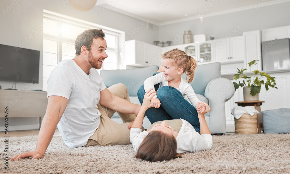 Wall mural Home, family and parents playing with child in living room for funny game, love and support on weekend. Excited, father and mother bonding with girl on carpet for joke, humor and laughing together