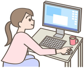 パソコンの前に座る女性