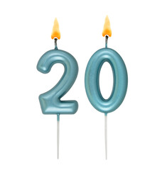 Burning blue birthday candles isolated on white background, number 20