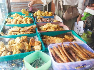 Fried snack cart, called Gorengan in Indonesia. They sell fried risoles, sweet potatoes, tempeh, tofu, fried bananas, mixed vegetables called bakwan and so on