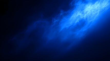 Ethereal blue smoke or mist in a dark background.