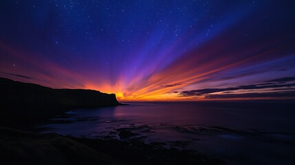 Fototapeta premium A stunning sunset over a coastal landscape, featuring vibrant colors and a starry sky.