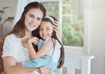 Fototapeta premium Hug, mom and child in home for portrait, comfort and support on weekend in Canada, Smile, mother or daughter in living room with happiness, relax or bonding with care and security in family with love