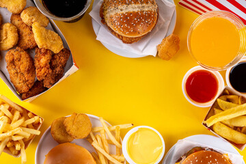 Fast food delivery menu background with various burgers, cheeseburger, nuggets, french fries, fizzy...