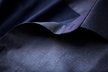 Close up of dark Men's shirt. Soft focus. Copy space.	