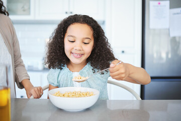 Mom, girl and breakfast cereal in home, nutrition and milk porridge for vitamins or minerals....