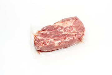 A piece of meat is displayed in a plastic bag. The meat is white and pink Pork meat isolated on white background..
