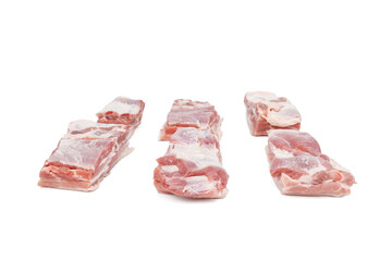 A close up of a slab of meat with a white background. The meat is cut into six pieces Pork meat isolated on a white background.