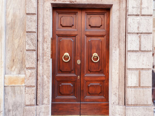 Classic entrance door to the building, vintage wooden front door