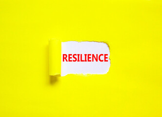 Resilience symbol. Concept word Resilience on beautiful white paper. Beautiful yellow paper background. Business resilience concept. Copy space.