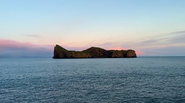 Elli&eth;aey island at Iceland&rsquo;s Vestmannaeyjar and open ocean seen from boat