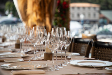 wine glasses on table in fancy restaurant by the sea