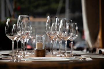 wine glasses on table in fancy restaurant by the sea