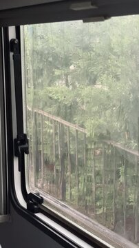 View from the window inside the caravan raining.