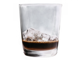 A glass of iced coffee with ice cubes almost empty.