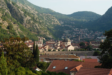 Fototapeta premium Kotor, Montenegro. View of St. Nicholas Church with mountains in the background